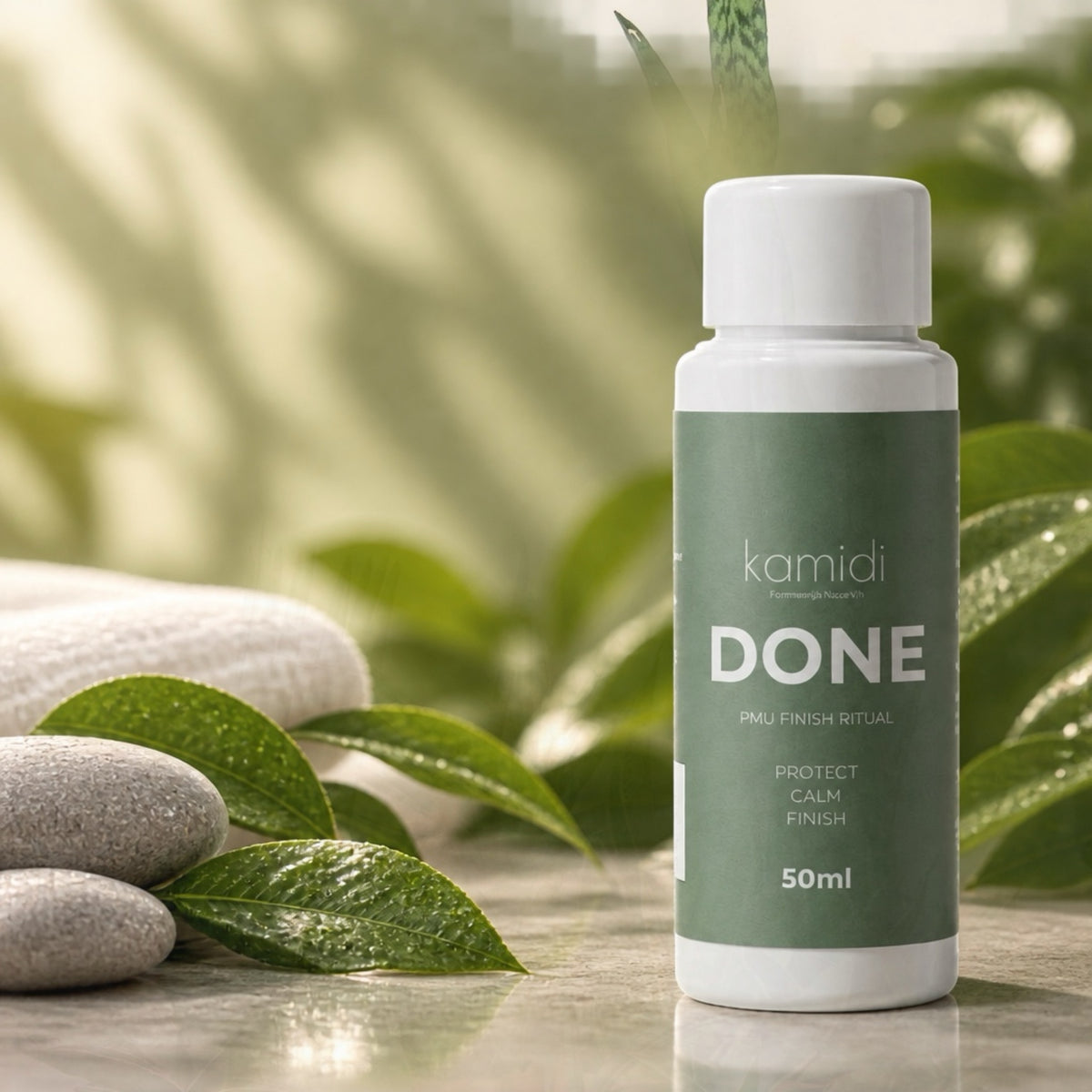 KAMIDI DONE PMU Finish 50 ml Flasche mit Pflanzenblättern und Steinen
